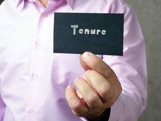 Business concept about Tenure  with sign on the piece of paper.