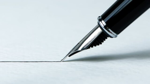 Closeup view of a fountain pen drawing a straight ink line on a textured paper surface