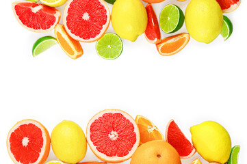 Flat lay composition with citrus fruits, leaves and flowers on white background, copy space.