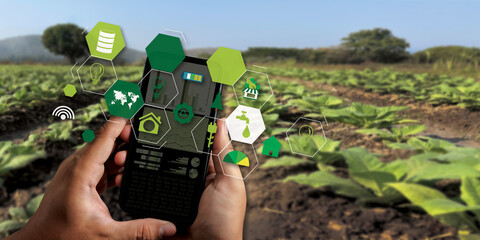 agriculture technology concept man Agronomist Using a Tablet Internet of things report. © onephoto