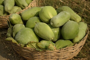 green papaya in the wicker basket