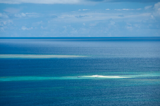 The beautiful turquoise blue sea and Barasu island on background seen from the road to Mount Uehara.