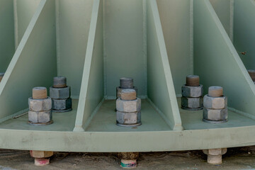 Large nuts and bolts holding steel platform