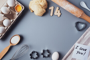 Making cookies for Valentine's Day, flat lay, top view, copy space. Various ingredients, rolling...