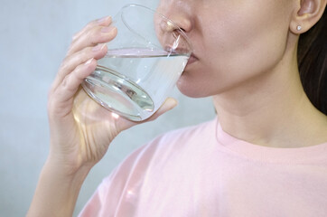 girl drinking water close-up