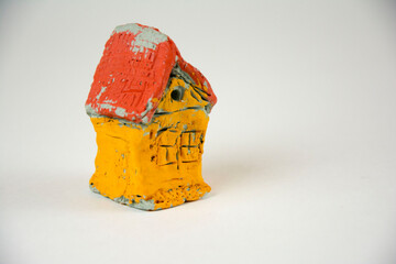 decorative clay house with a white background