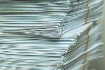 pile of paper documents in the office