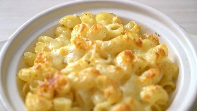 mac and cheese, macaroni pasta in cheesy sauce - American style
