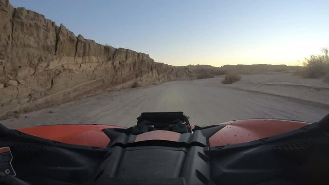 Driving and Offroad vehicle down a desert road