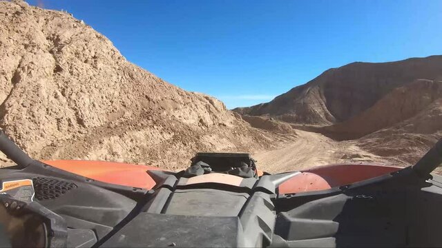 Driving and Offroad vehicle down a desert road