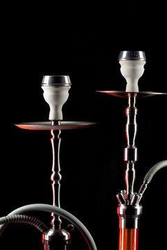 Ceramic tobacco bowl of hookah on black background