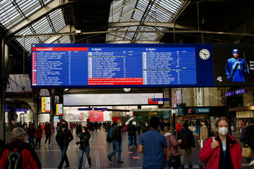 Passengers at main hall of railway main station Hauptbahnhof at Swiss City of Zurich.