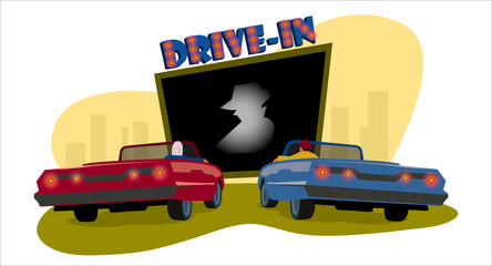 Drive-in cinema. Drive-in theater. Open space auto theater with movie going on, cars parked nearby, city behind.