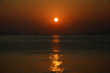 sunset over the black sea and spread orange light 