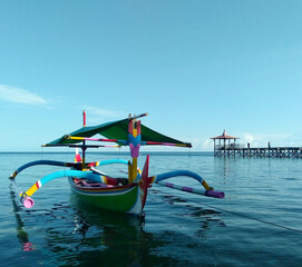 Fototapeta na wymiar Fishing boats at the White Sand tourist spot, Situbondo - Indonesia