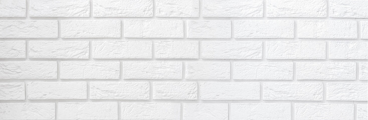 Fototapeta premium A white brick wall. Copy space for text. Banner