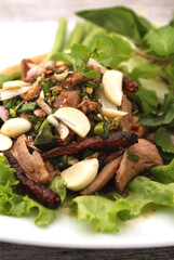Thai Spicy pork neck salad , Isaan foods, local north-eastern Thailand foods.