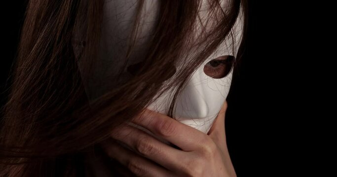 portrait of a woman wearing a white mask