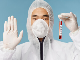 Asian male laboratory covid-19 blood test diagnostics of coronavirus