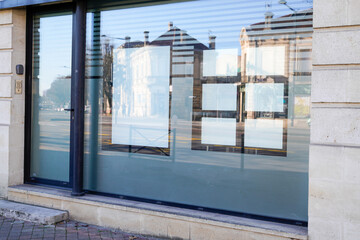 modern store facade windows showcase with blank empty white signs and posters