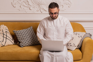 Muslim man. Portrait of a young arab man in traditional dress. 