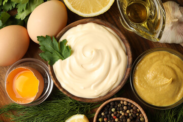 Board with bowl of mayonnaise and ingredients for cooking, top view
