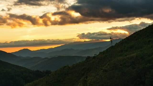 Time lapse view of colorful sunset landscape in Huai Thon Village, Nan, Thailand. Footage timelapse nature landscape view and colored sky.