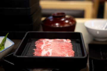 Raw slice beef in Japanese shabu shabu sukiyaki.