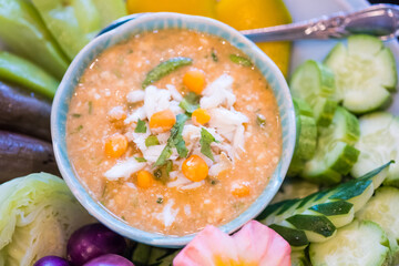 Spicy crab roe chili sauce serve with fresh vegetable and cooked vegetable. Nice healthy meal