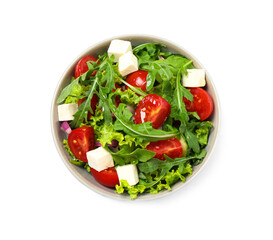 Delicious salad with arugula and vegetables isolated on white, top view