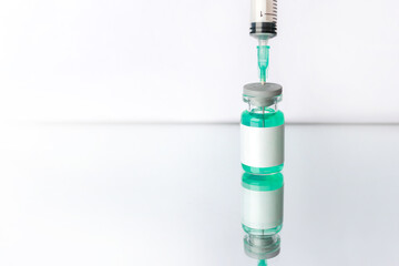 Ampoule mockup. Syringe on white reflective surface. Healthcare and medical concept. Vaccine.