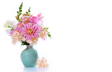 Bouquet of garden pink flowers in vase on awhite background.