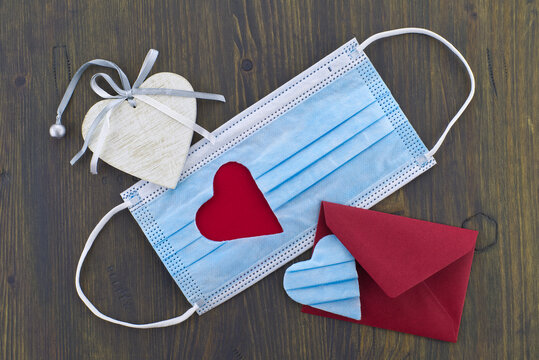Face mask with cut out heart shape and envelope