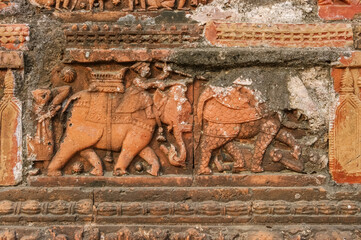 Carved terracotta scene of war elephants on beautiful ancient Chauchala Chhota Govinda Mandir in Puthia temple complex, Rajshahi district, Bangladesh