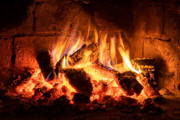 A fire burns in a fireplace, Fire to keep warm