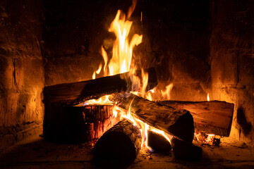 A fire burns in a fireplace, Fire to keep warm