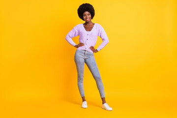 Fototapeta na wymiar Full length photo of charming dark skin person put hands on waist wear violet outfit isolated on yellow color background