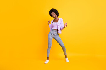 Fototapeta na wymiar Full body photo of cool positive dark skin lady look empty space toothy smile isolated on yellow color background