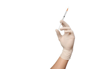 isolated hand in a medical glove preparing for an injection with a syringe on a white background....