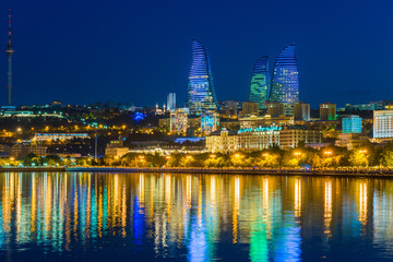 Fototapeta na wymiar Baku, Azerbaijan - June 23, 2018: Colorful lights on Flame towers, symbol of baku at night.
