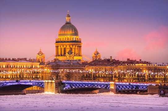 The dome of St. Isaac's Cathedral, the Palace Bridge and the Neva River in ice in St. Petersburg