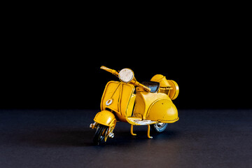 Old toy vespa motorbike on different backgrounds 