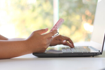 Young woman hand using mobile smartphone.