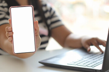 Young woman hand using mobile smartphone with blank white screen.