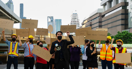 Group of young people wearing face mask and activists protesting in the city.