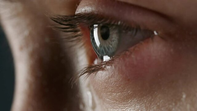 Macro video of allergic woman with tears