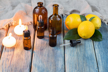 oil pump dispenser bottles, candles and lemons - aromatherapy