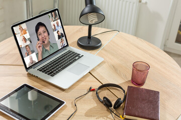 Group Friends Video Chat Connection Concept. Laptop on table, home interior.