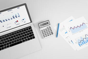 Workplace with financial charts, laptop, calculator and pen on the desk. 3d rendering.