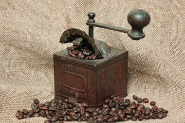 coffee grinder and coffee in grains